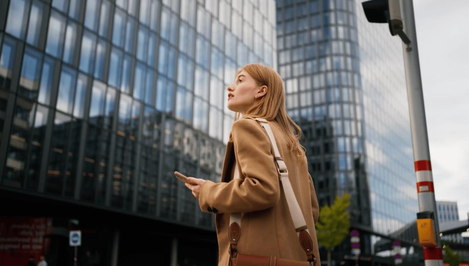 Women in a city looking up.