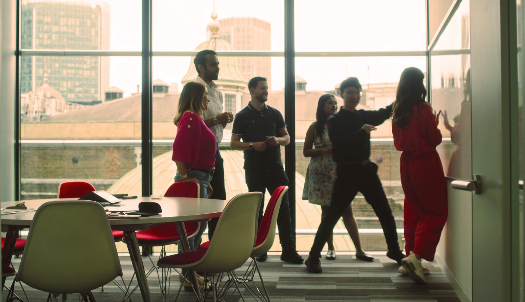 Group of people working on a whiteboard