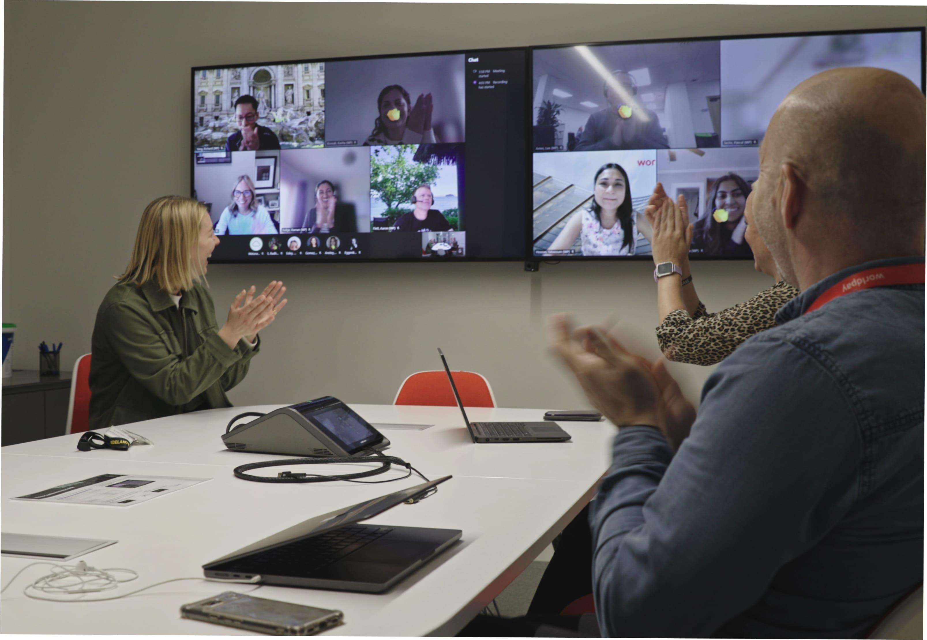 Group of workers celebrating on a zoom call.